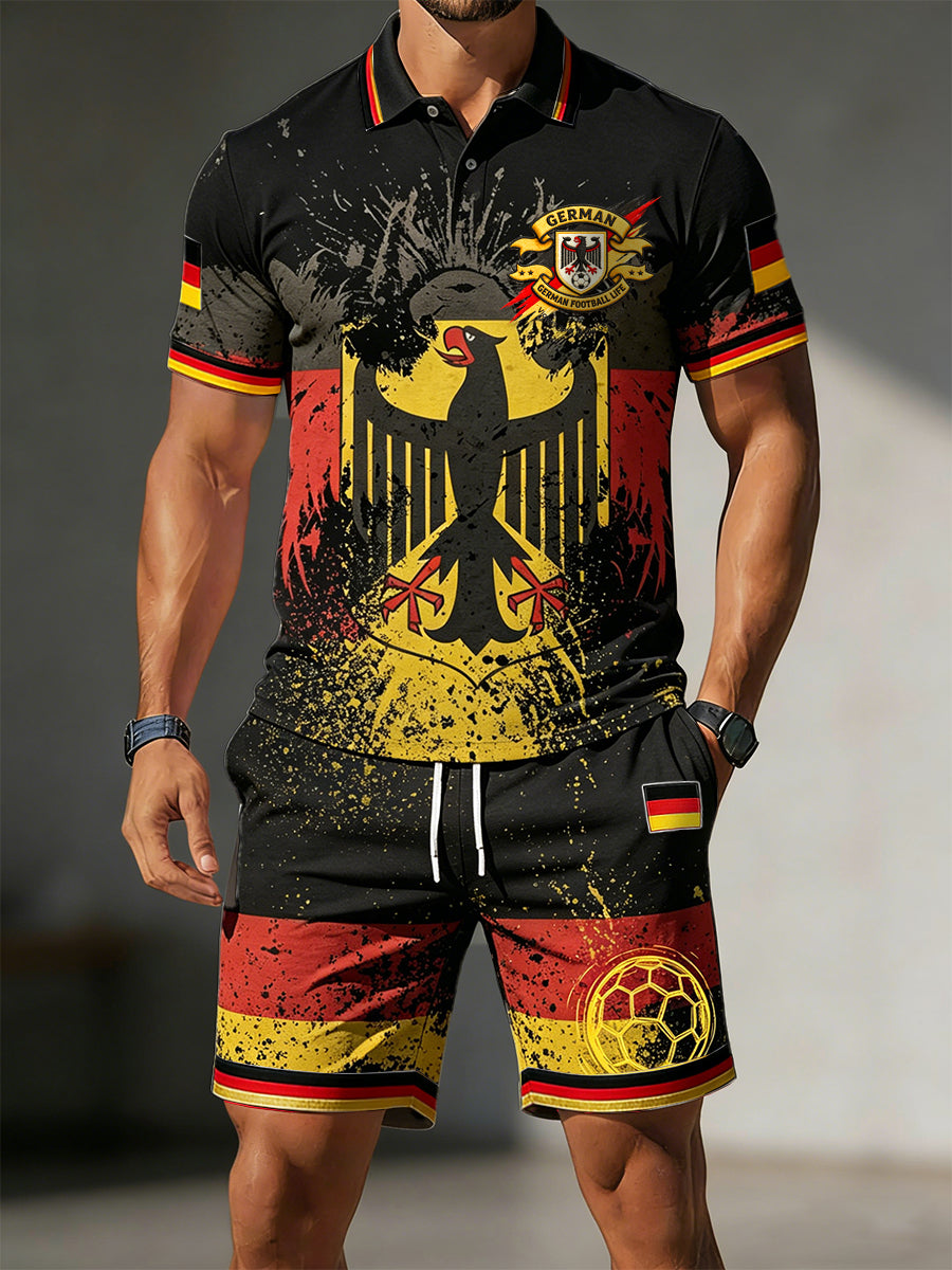 Herren-Set bestehend aus schwarzer Sport-Poloshirt mit deutscher Flagge und Graffiti-Print sowie passenden Shorts